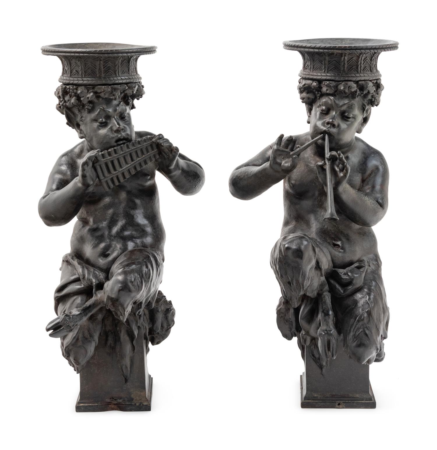 A Pair of Cast Metal Figures of Musical Fauns