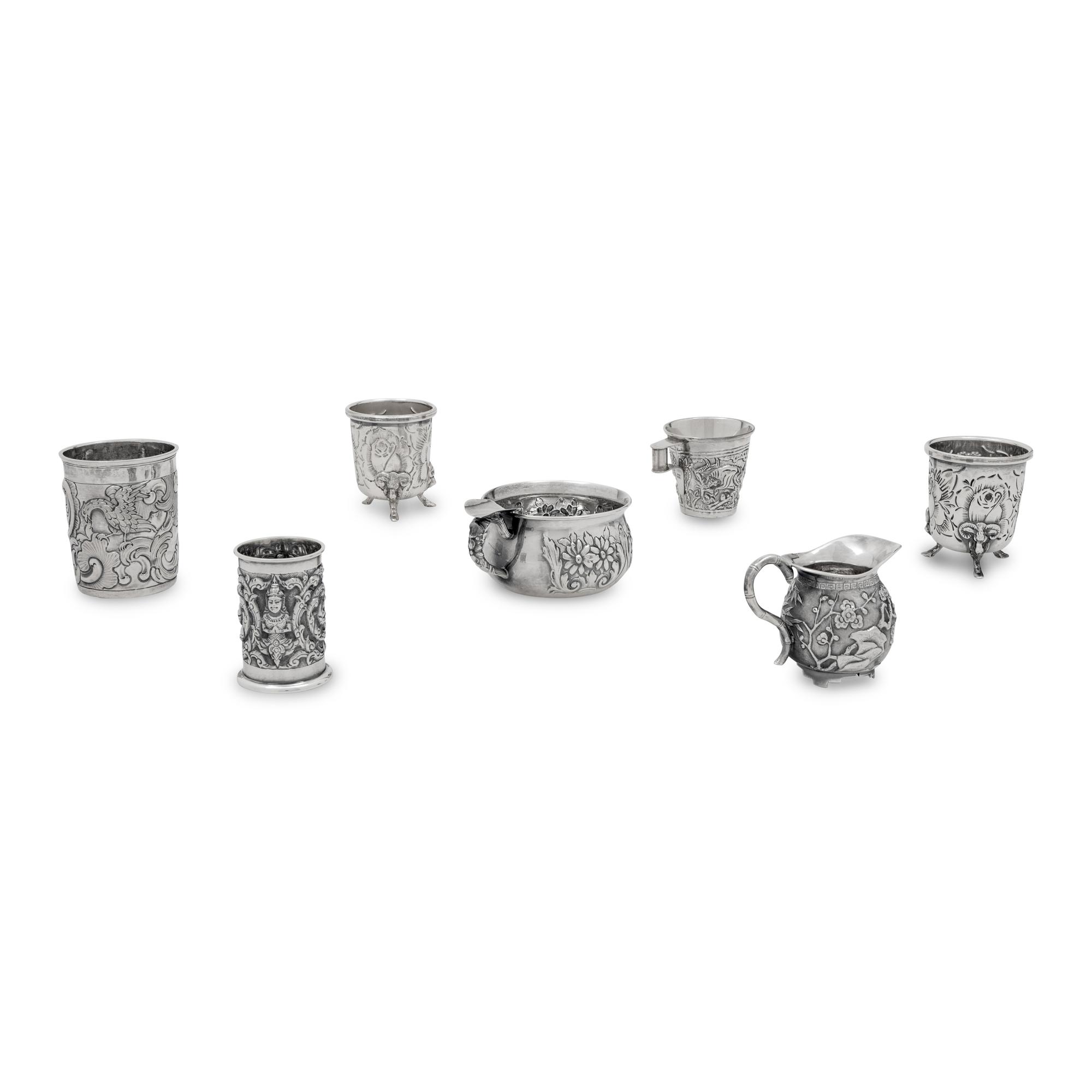 A Collection of Silver Repousse Decorated Table Articles