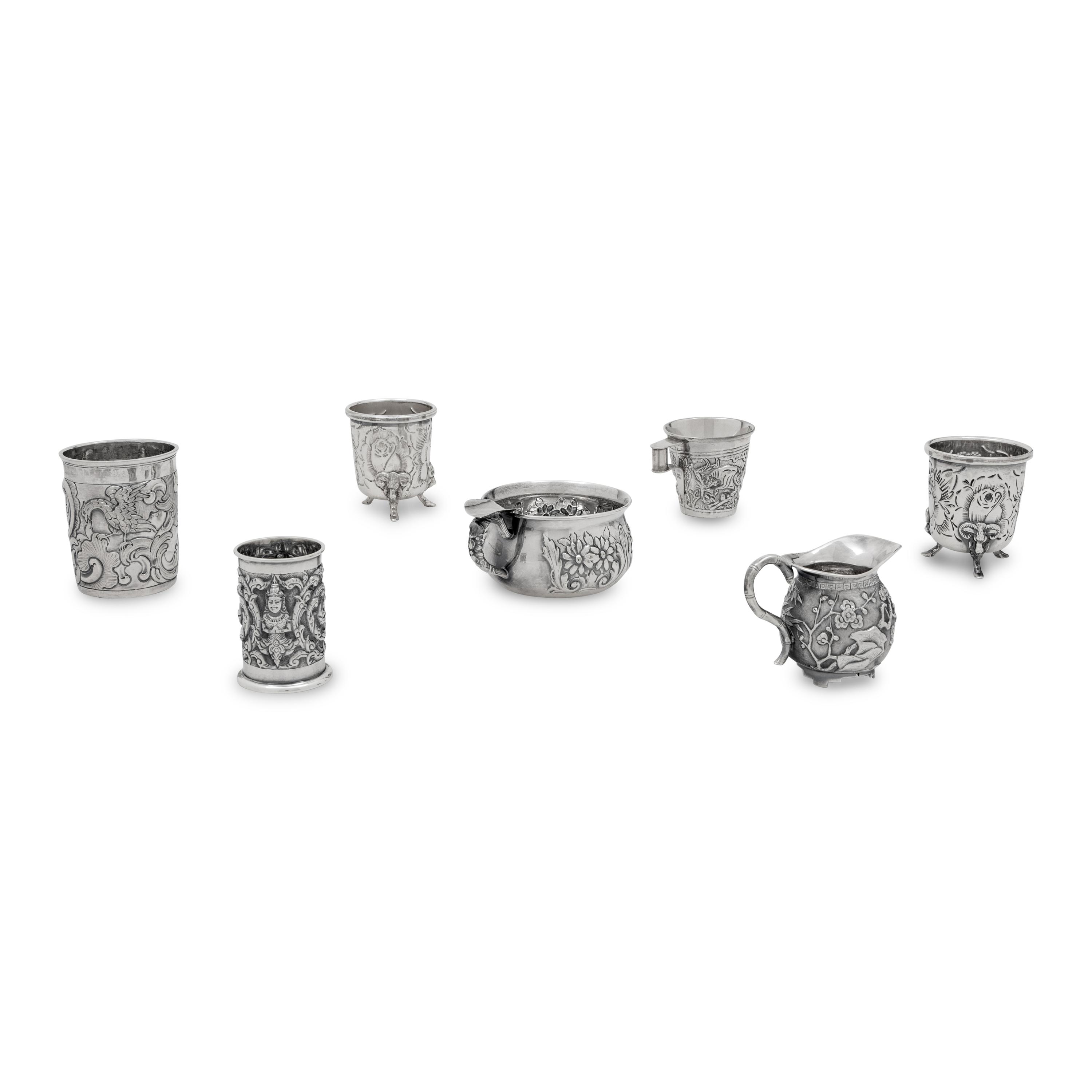 A Collection of Silver Repousse Decorated Table Articles