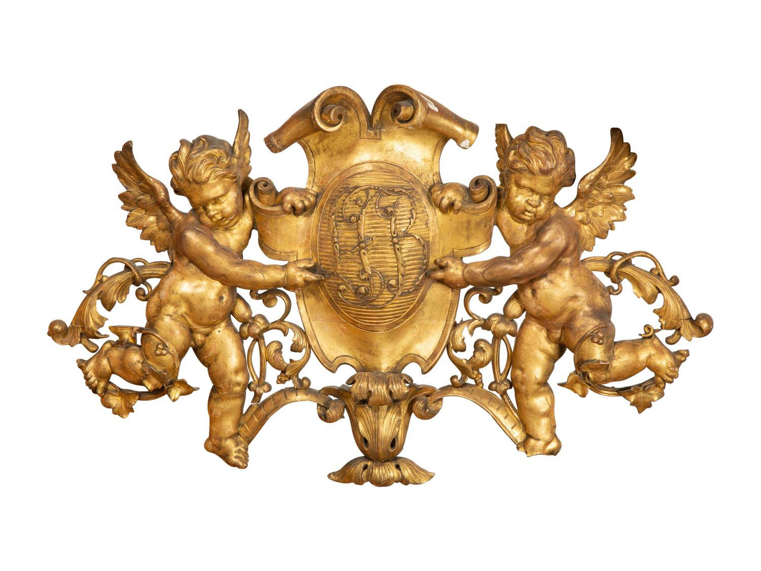 A Continental Carved Giltwood Cherub Wall Plaque