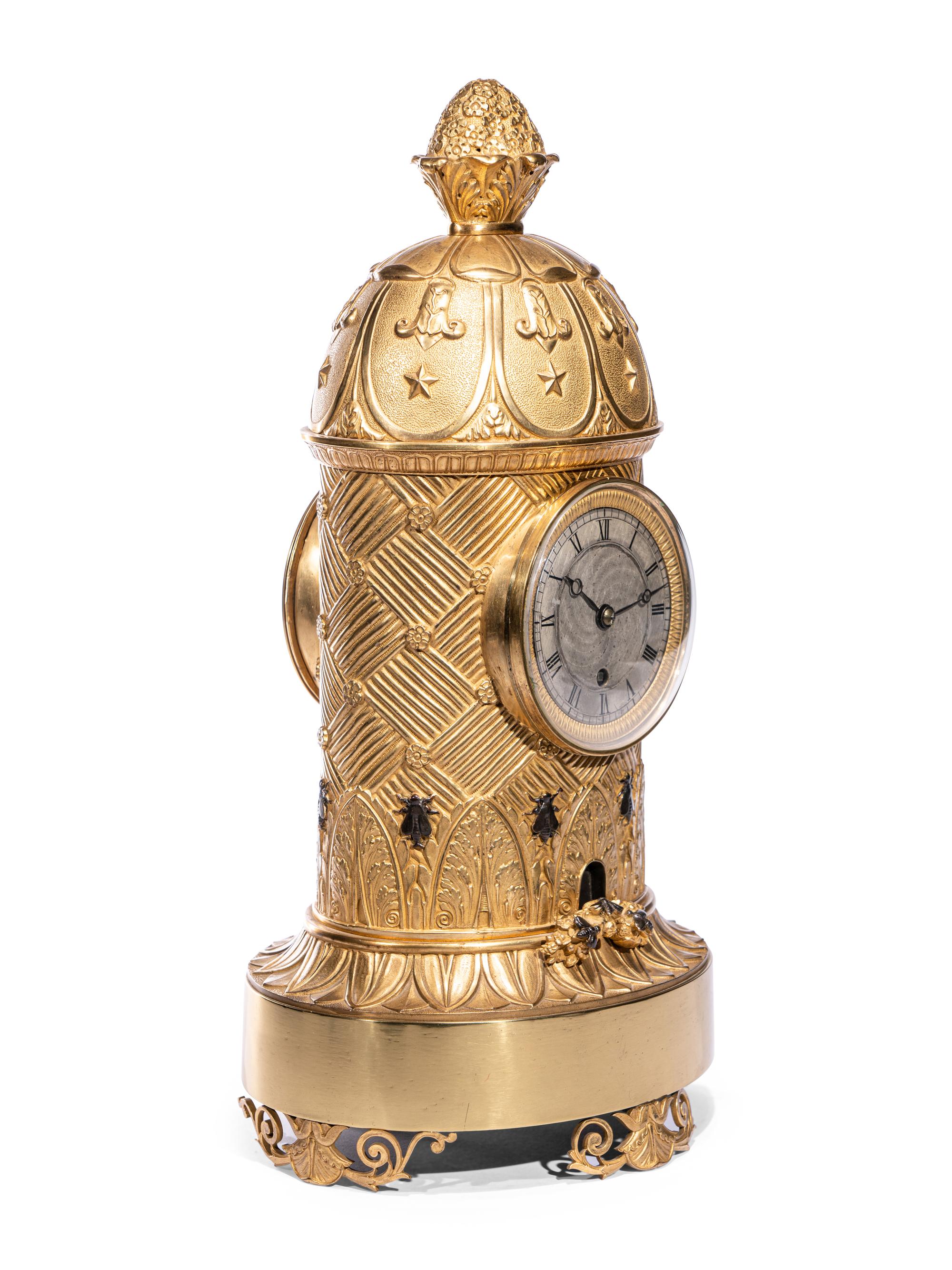 A Charles X Ormolu and Patinated Bronze Beehive Clock