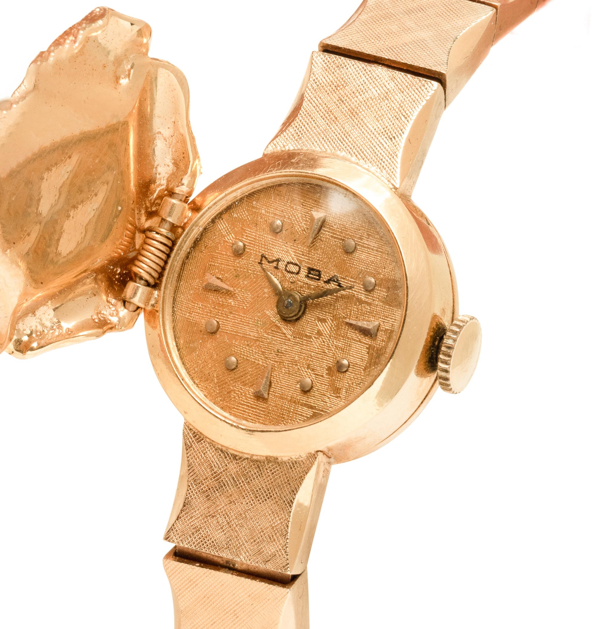 MOBA, 14K YELLOW GOLD AND DIAMOND SURPRISE WATCH