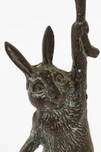 A Pair of Patinated Cast Metal Rabbit Candlesticks