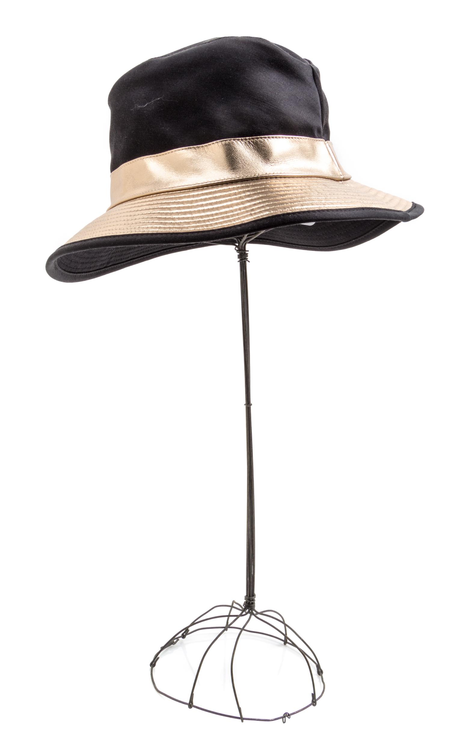 An Hermes Black Fabric and Metallic Leather Hat, Size 56.