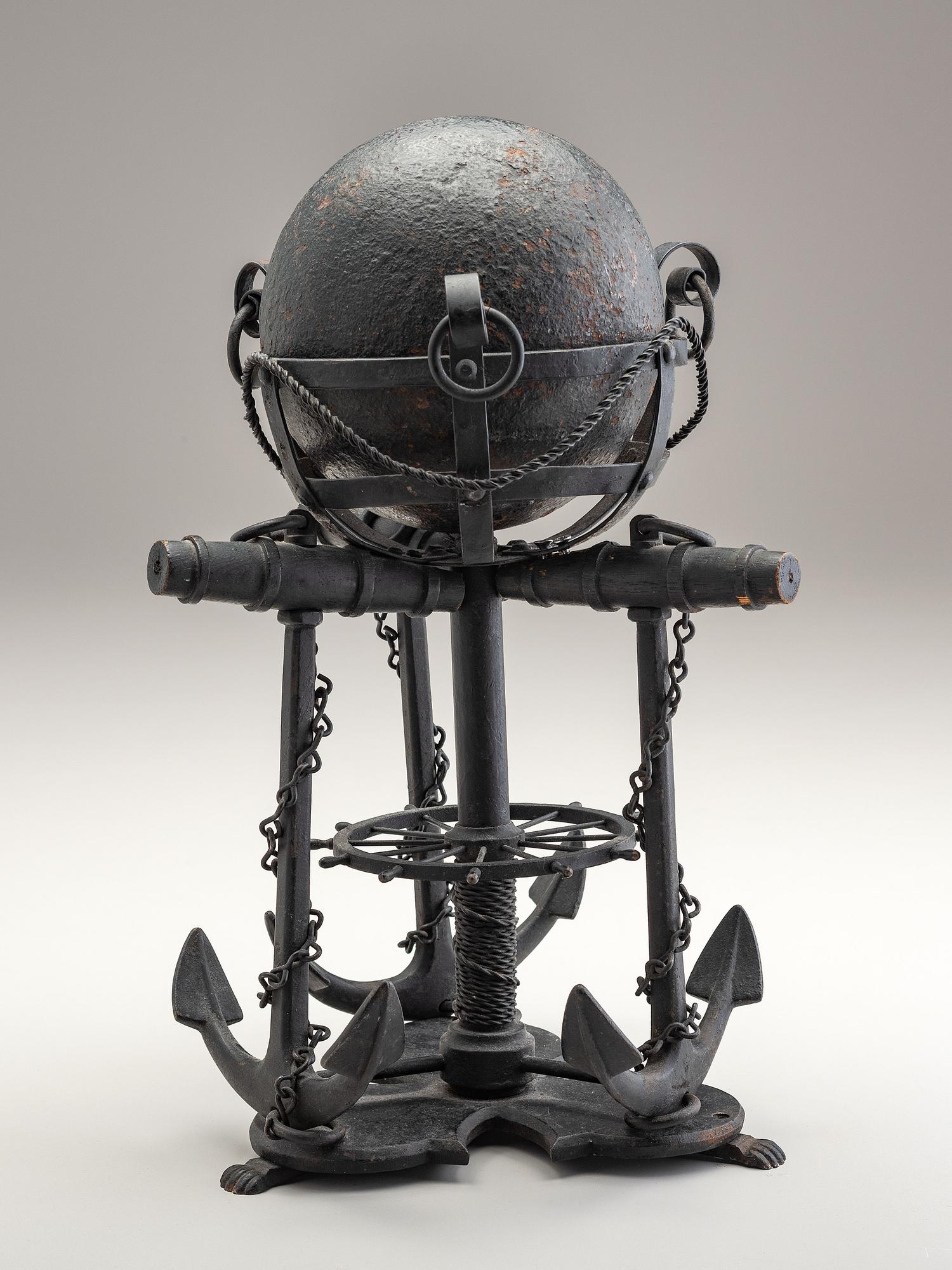A Nautical Carved Wood and Iron Cannon Ball Stand