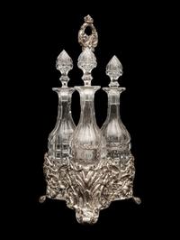 An English Silver-Plate Tantalus with Three Cut Glass Decanters