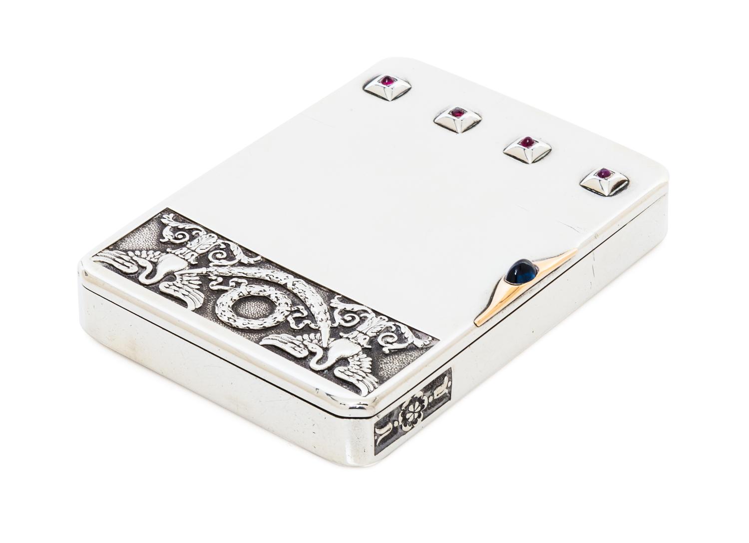 A Russian Ruby and Sapphire Inset Silver Cigarette Case, Mark of Faberge with Imperial warrant, Moscow, 20th century, the lid worked to