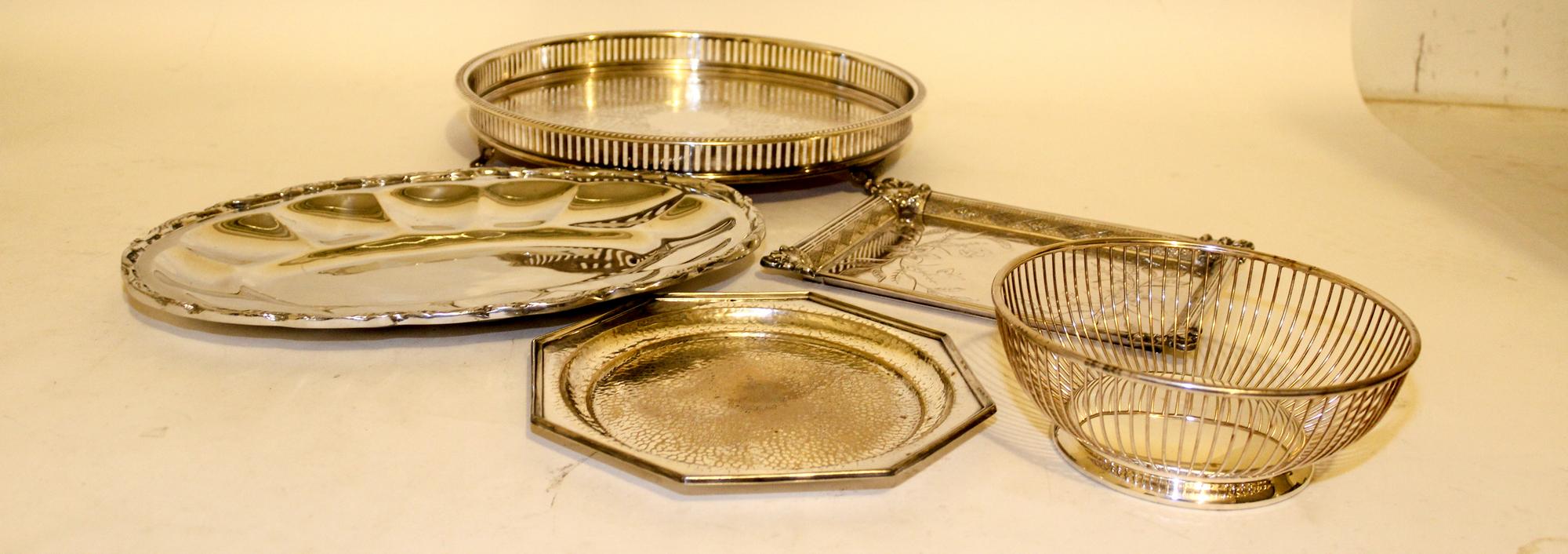Eleven Silver-Plate Serving Trays Width of largest overall handles 26 inches.