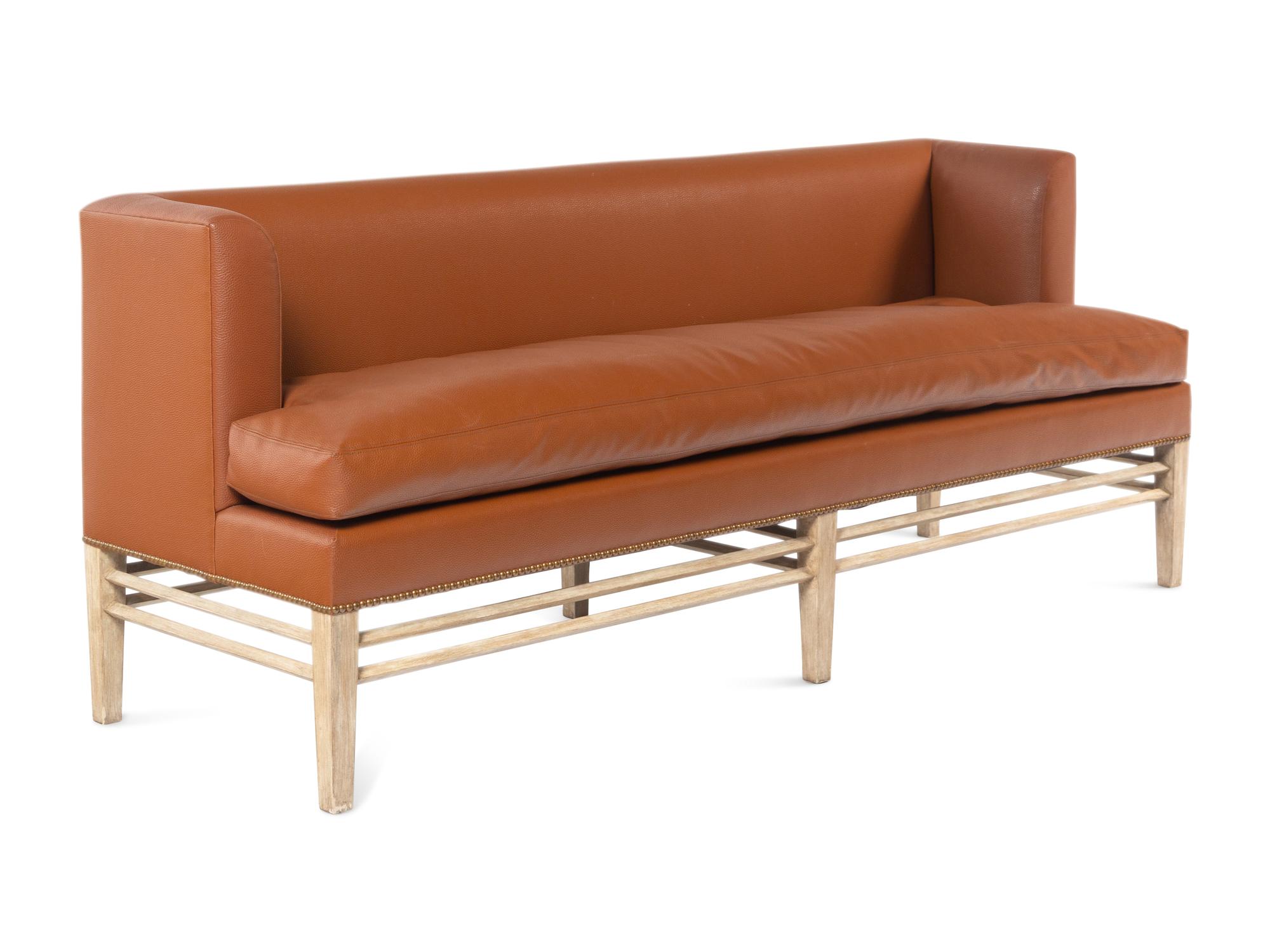 A Contemporary Faux Leather Upholstered Sofa