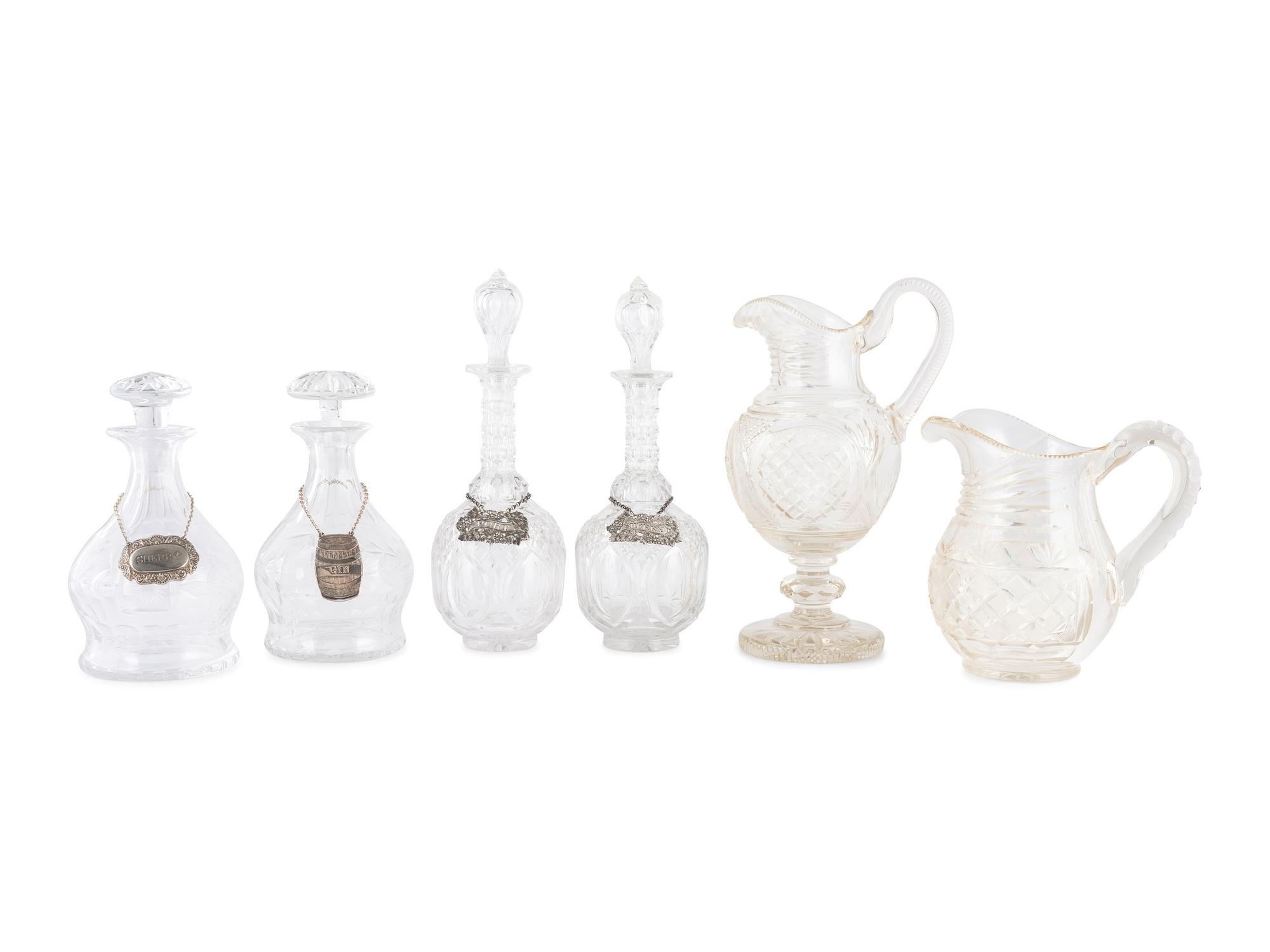 Four Cut Glass Decanters and Two Pitchers