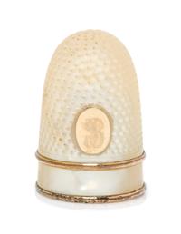 A French Palais Royal Mother-of-Pearl Thimble, Late 18th/Early 19th Century, the domed body with an applied gilt metal oval plaque bear