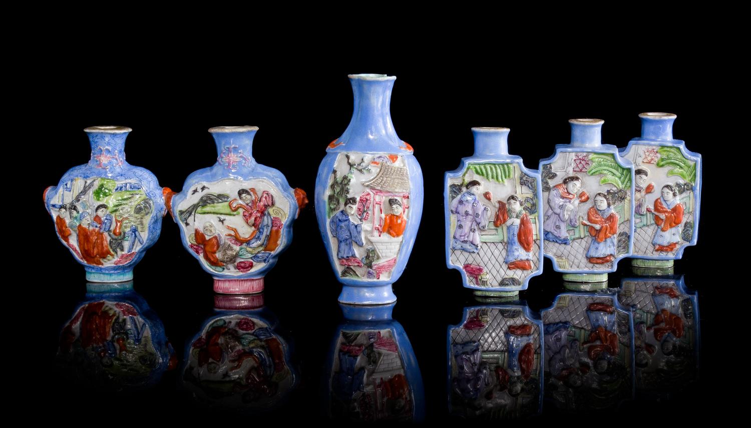 Six Molded Famille Rose Porcelain Snuff Bottles Height of tallest 3 7/8 inches. — EARLY 20TH CENTURY
