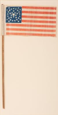 [FLAGS]. 36-star American parade flag in a rare "Great-Star-in-a-Wreath" pattern. Ca 1865-1867.