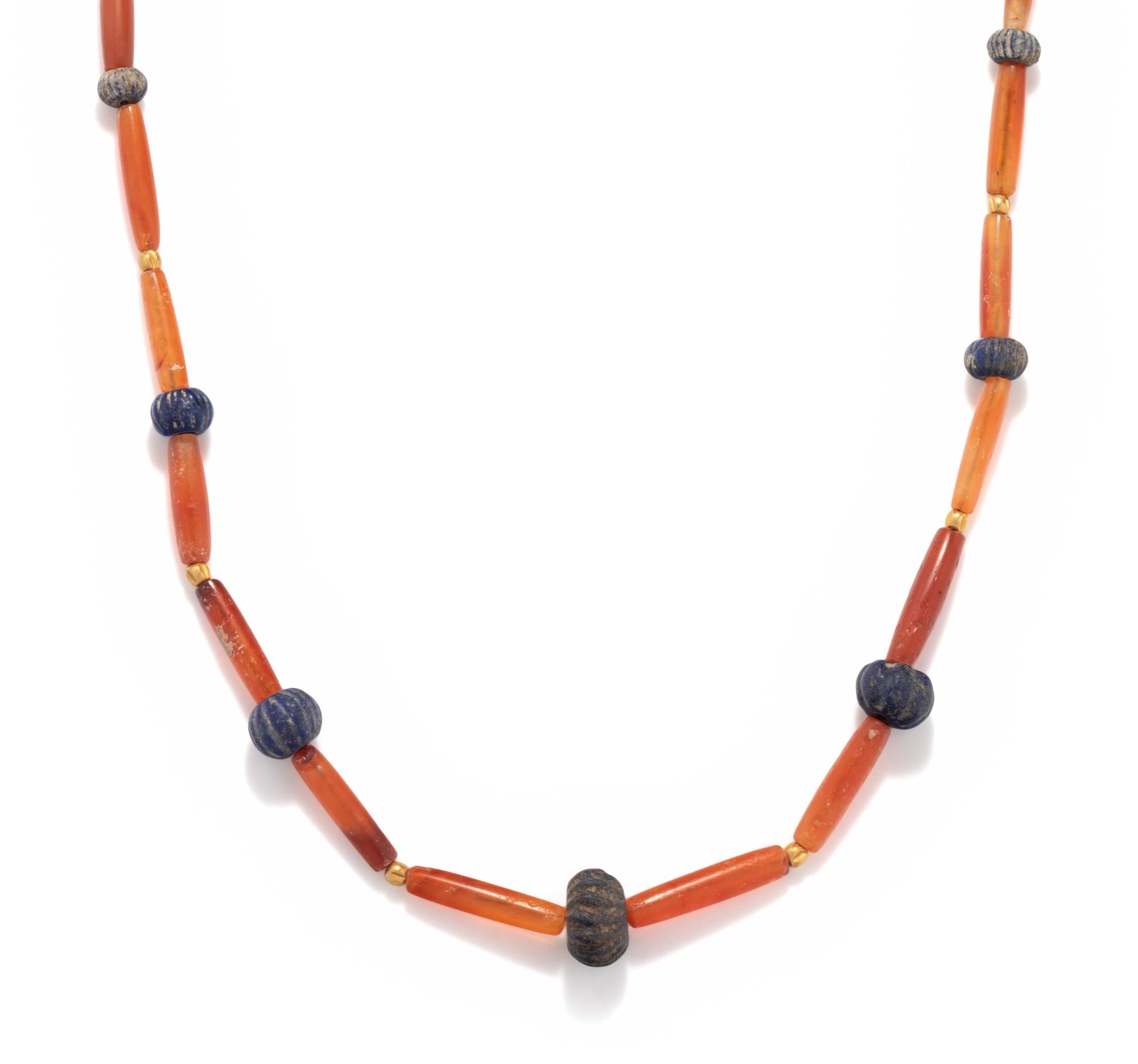 A Sumerian Lapis Lazuli, Carnelian, and Gold Bead Necklace