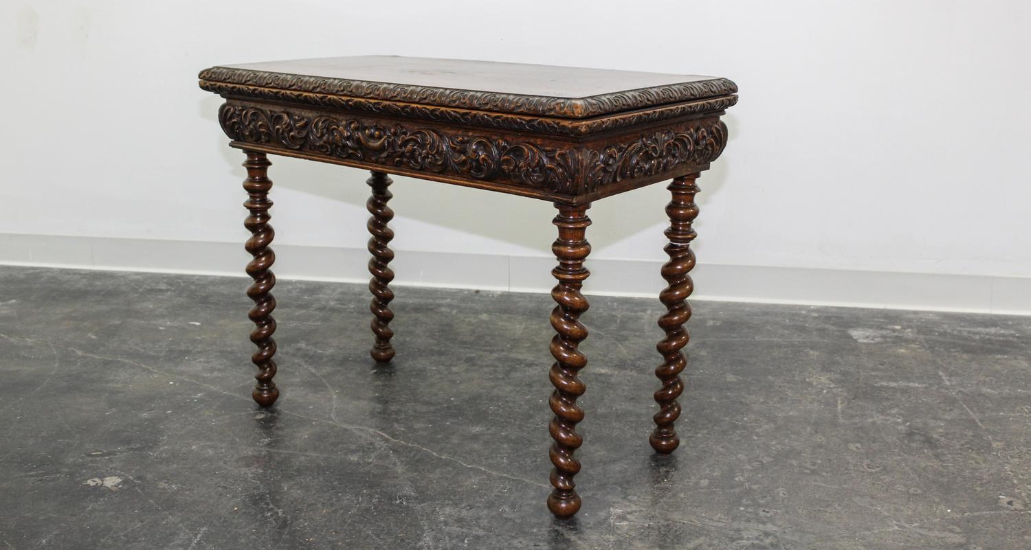 A Jacobean Revival Style Flip Top Games Table. Height 26 1/4 x width 34 1/2 x depth 17 1/4 inches.