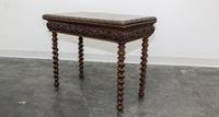 A Jacobean Revival Style Flip Top Games Table. Height 26 1/4 x width 34 1/2 x depth 17 1/4 inches.