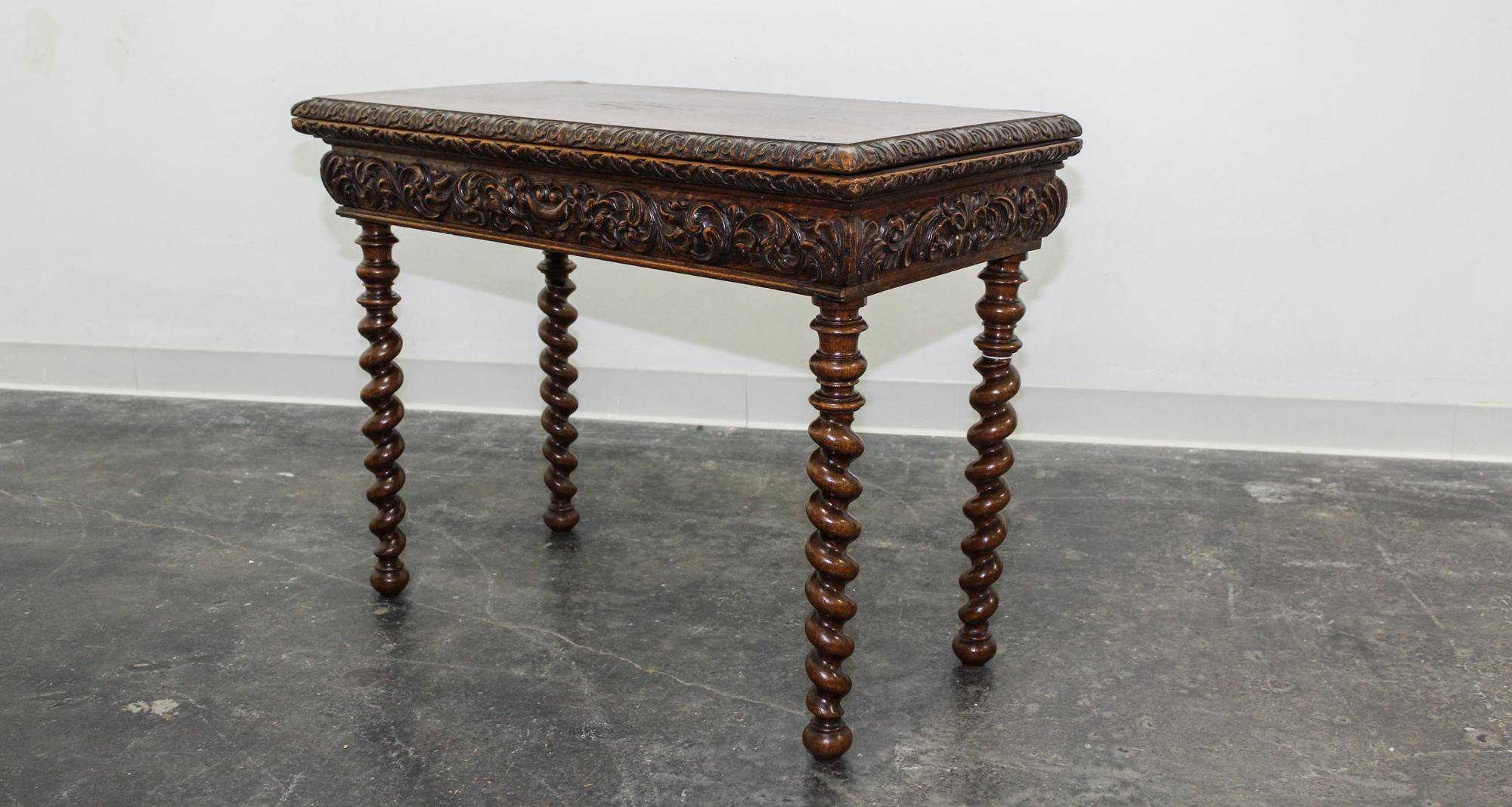 A Jacobean Revival Style Flip Top Games Table. Height 26 1/4 x width 34 1/2 x depth 17 1/4 inches.