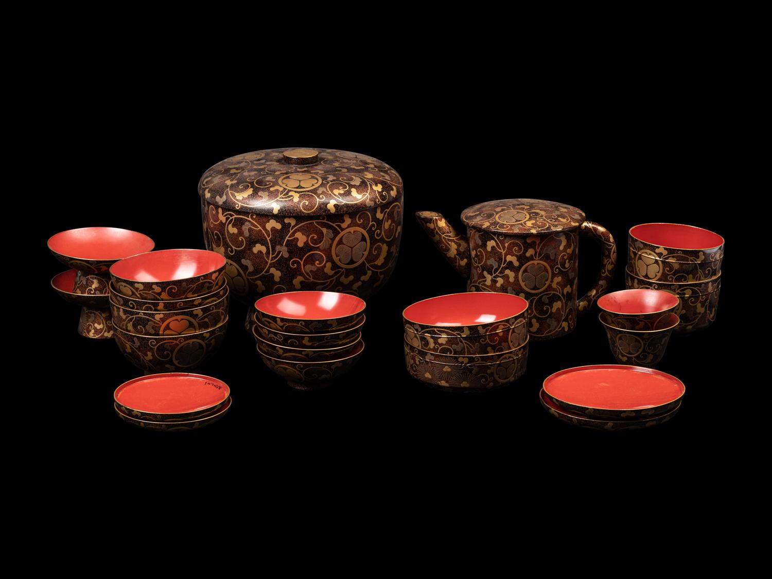 A Japanese Gold Decorated Brown and Red Lacquer Tableware Set