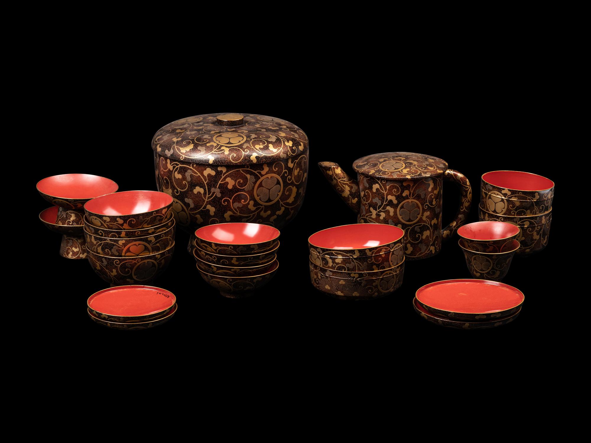 A Japanese Gold Decorated Brown and Red Lacquer Tableware Set