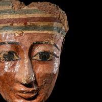 An Egyptian Painted Wood Mummy Mask