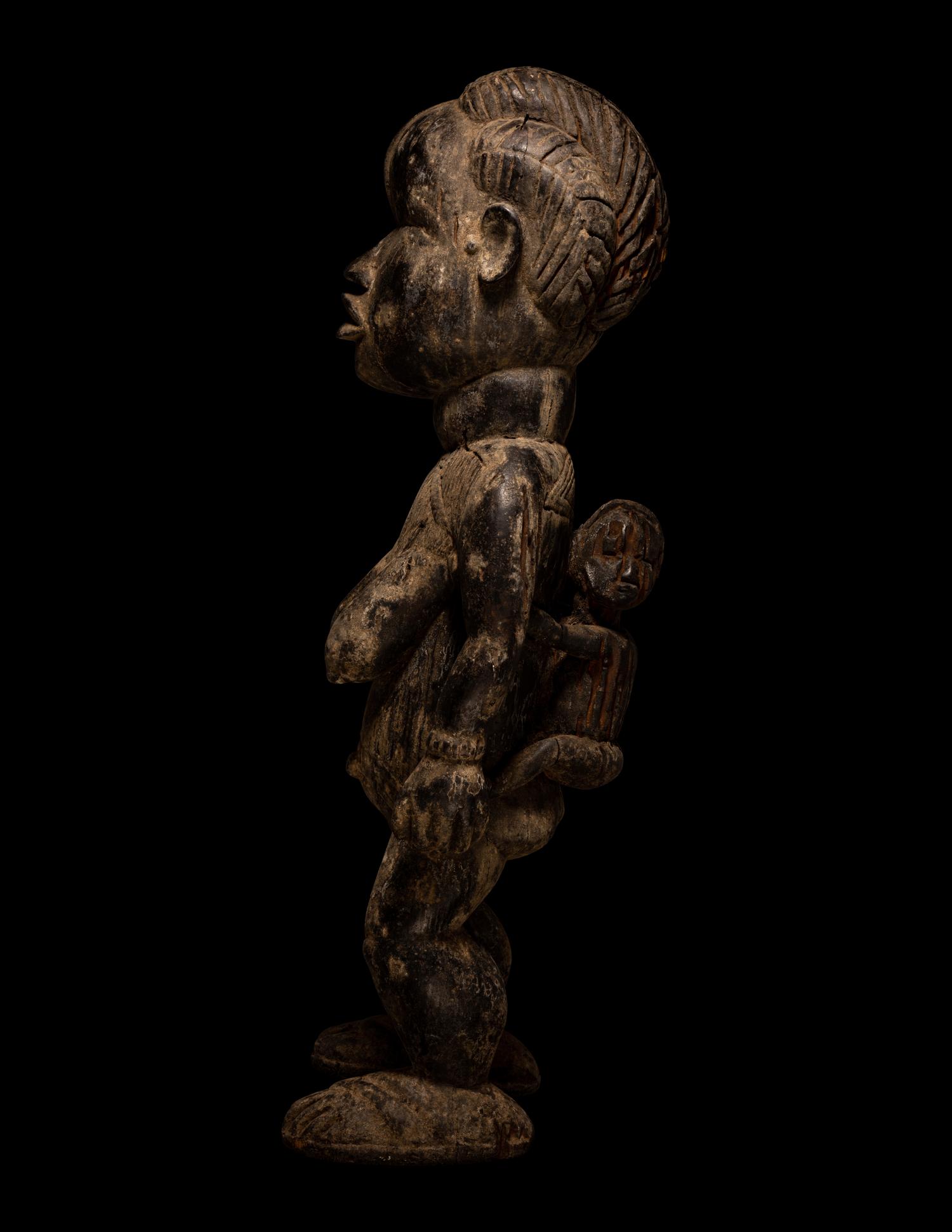 A Dan Wood Maternity Figure with Child
