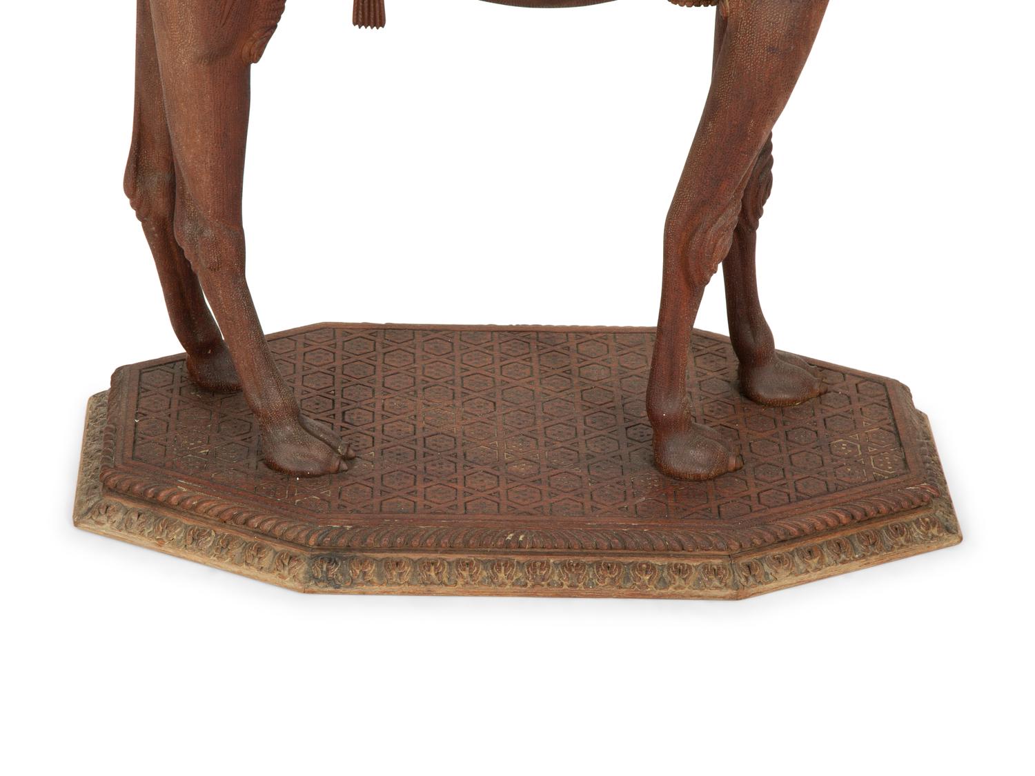An Anglo-Indian Carved Wood Camel-Form Side Table