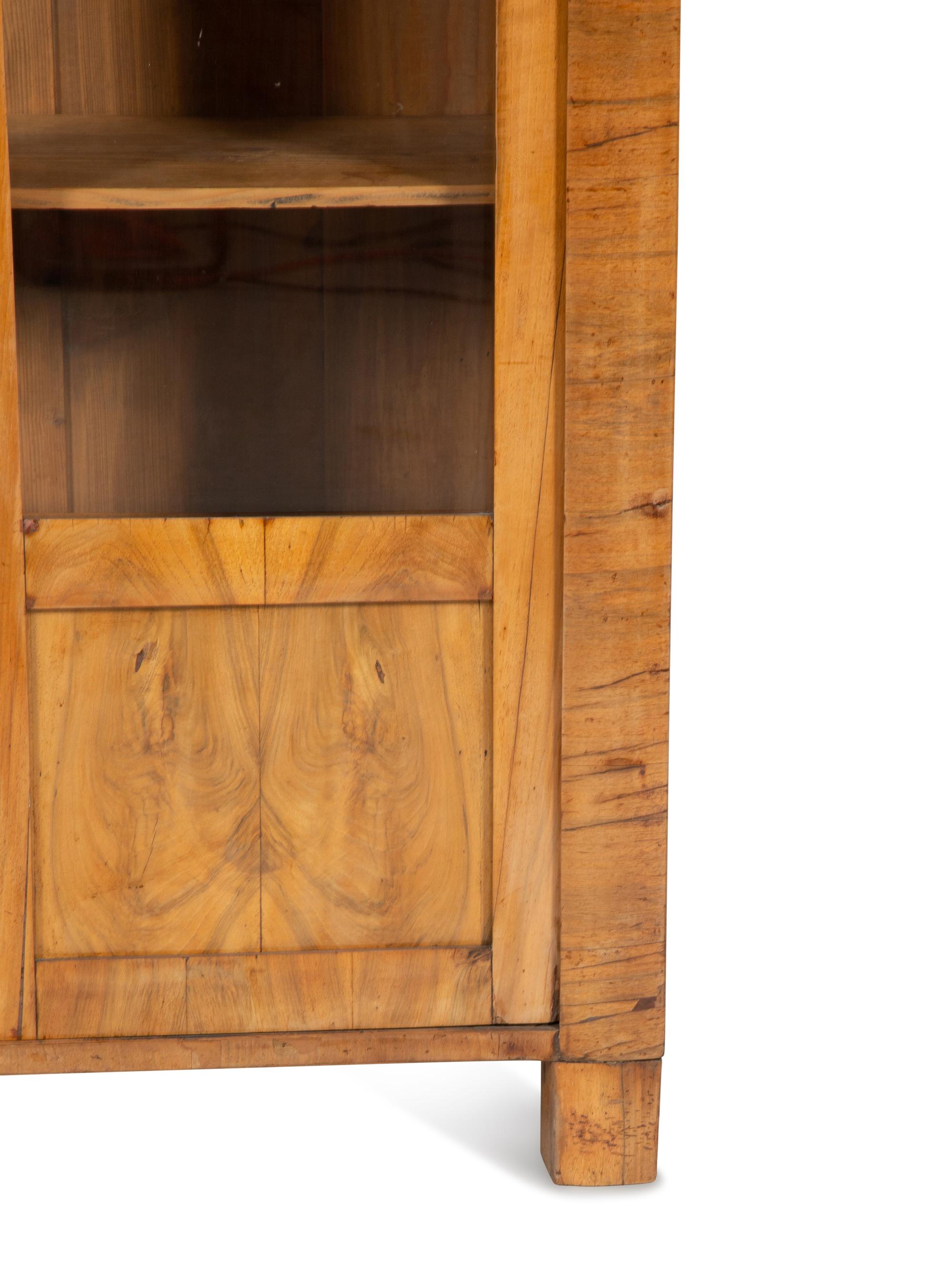 A Pair of Biedermeier Figured Birch Bookcases