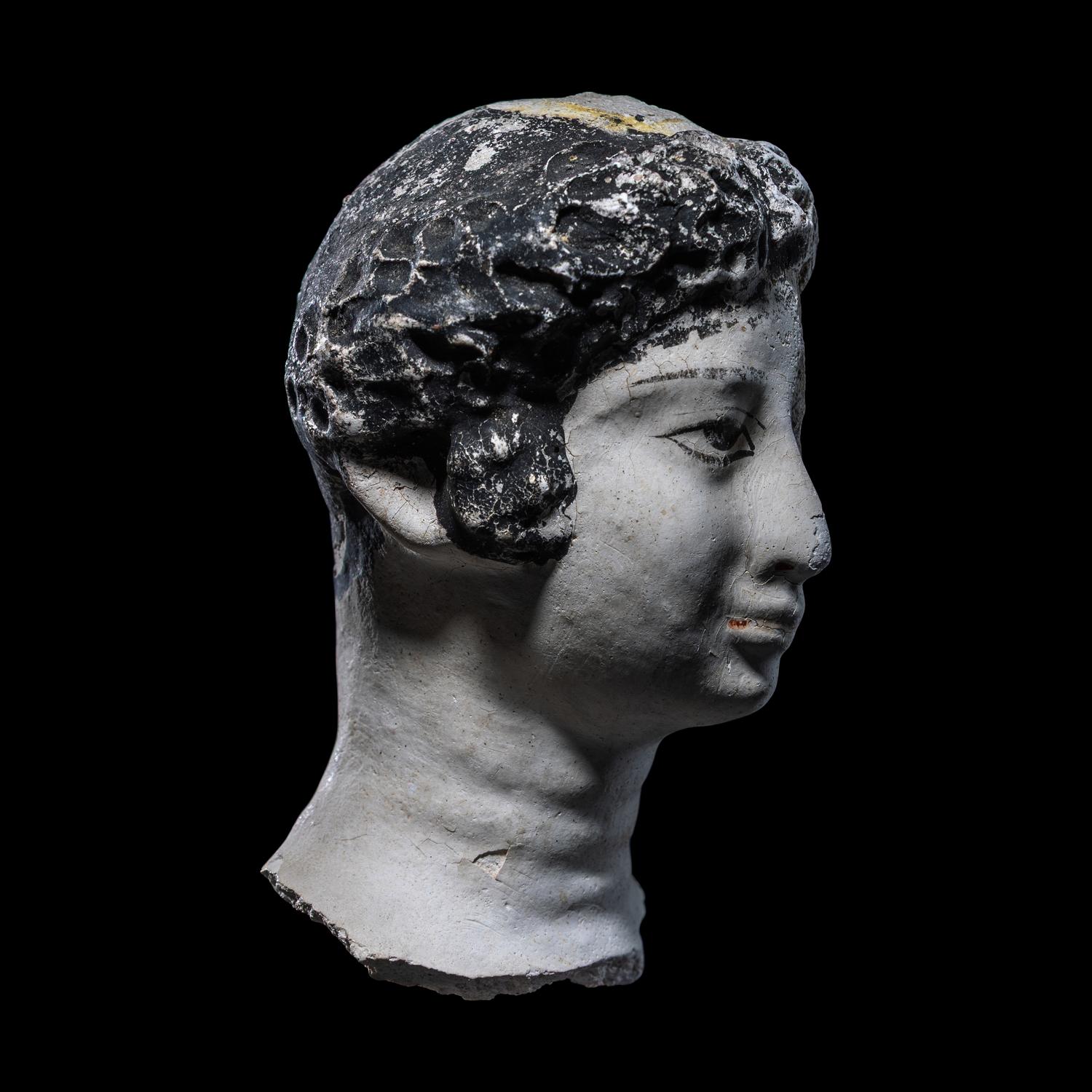 An Egyptian Painted Stucco Mummy Mask