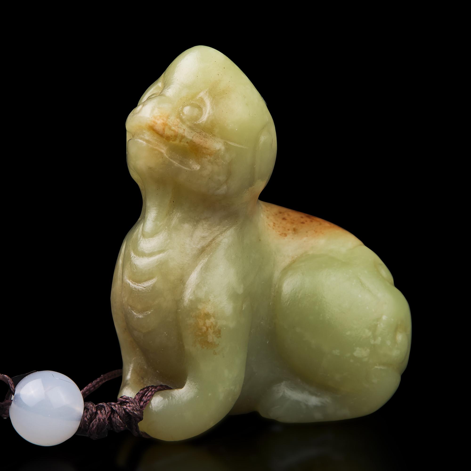 A Chinese Russet and Yellow Jade Figure of a Mythical Beast 青黃玉瑞獸