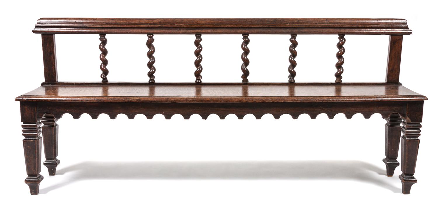 A Jacobean Revival Hall Bench Width 65 inches. — 19TH/20TH CENTURY
