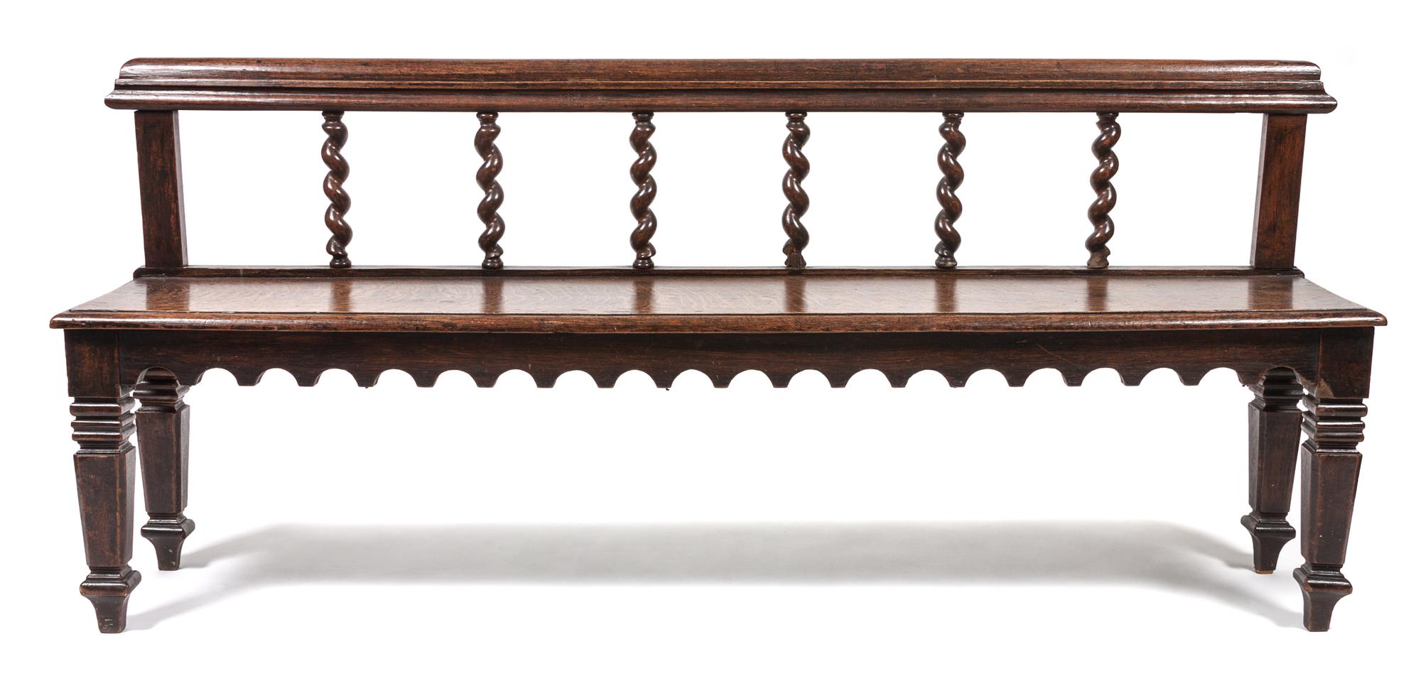 A Jacobean Revival Hall Bench Width 65 inches. — 19TH/20TH CENTURY