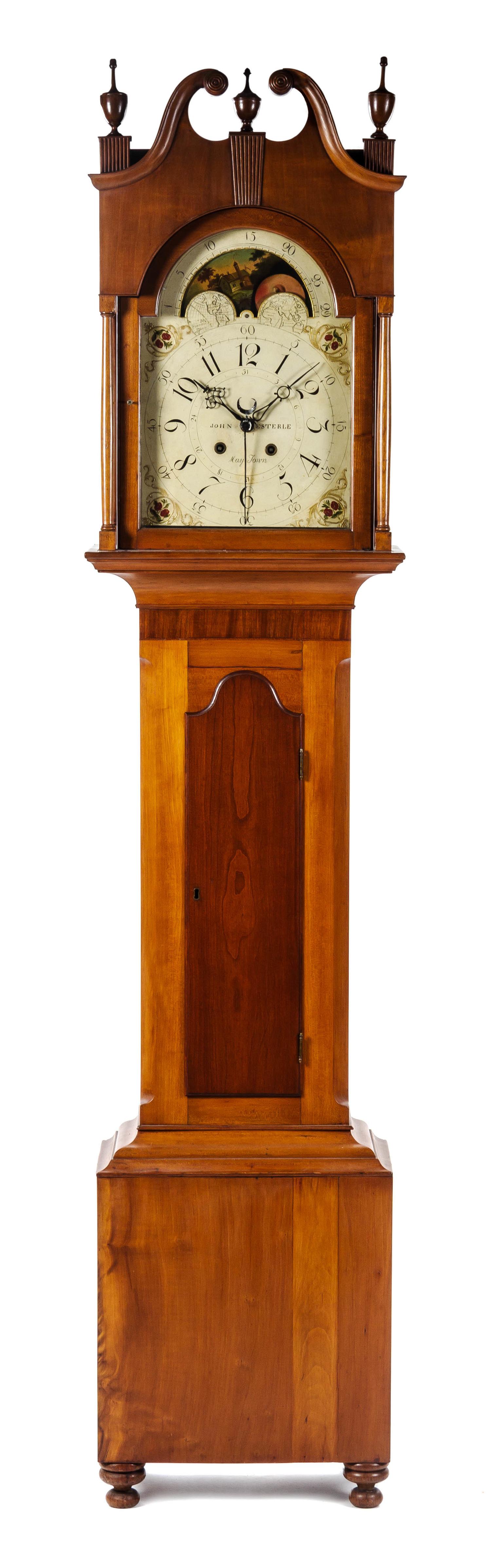 An American Cherry Long Case Clock, FIRST QUARTER 19TH CENTURY, JOHN ESTERLE, MAY TOWN, Height 89 1/2 inches. — FIRST QUARTER 19TH CENTURY, JOHN ESTERLE, MAY TOWN,