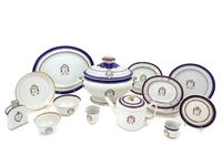 A Chinese Export Parcel Gilt, Blue and White Decorated Armorial Porcelain Partial Dinner Service