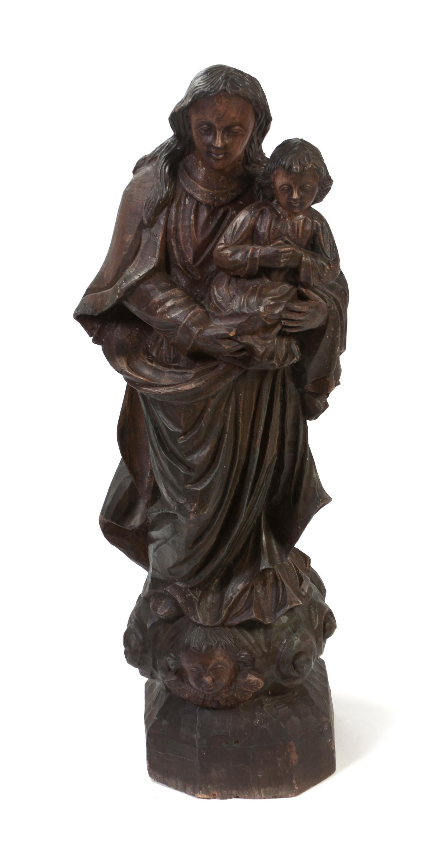 A Carved Wood Figural Group, Height 48 inches.