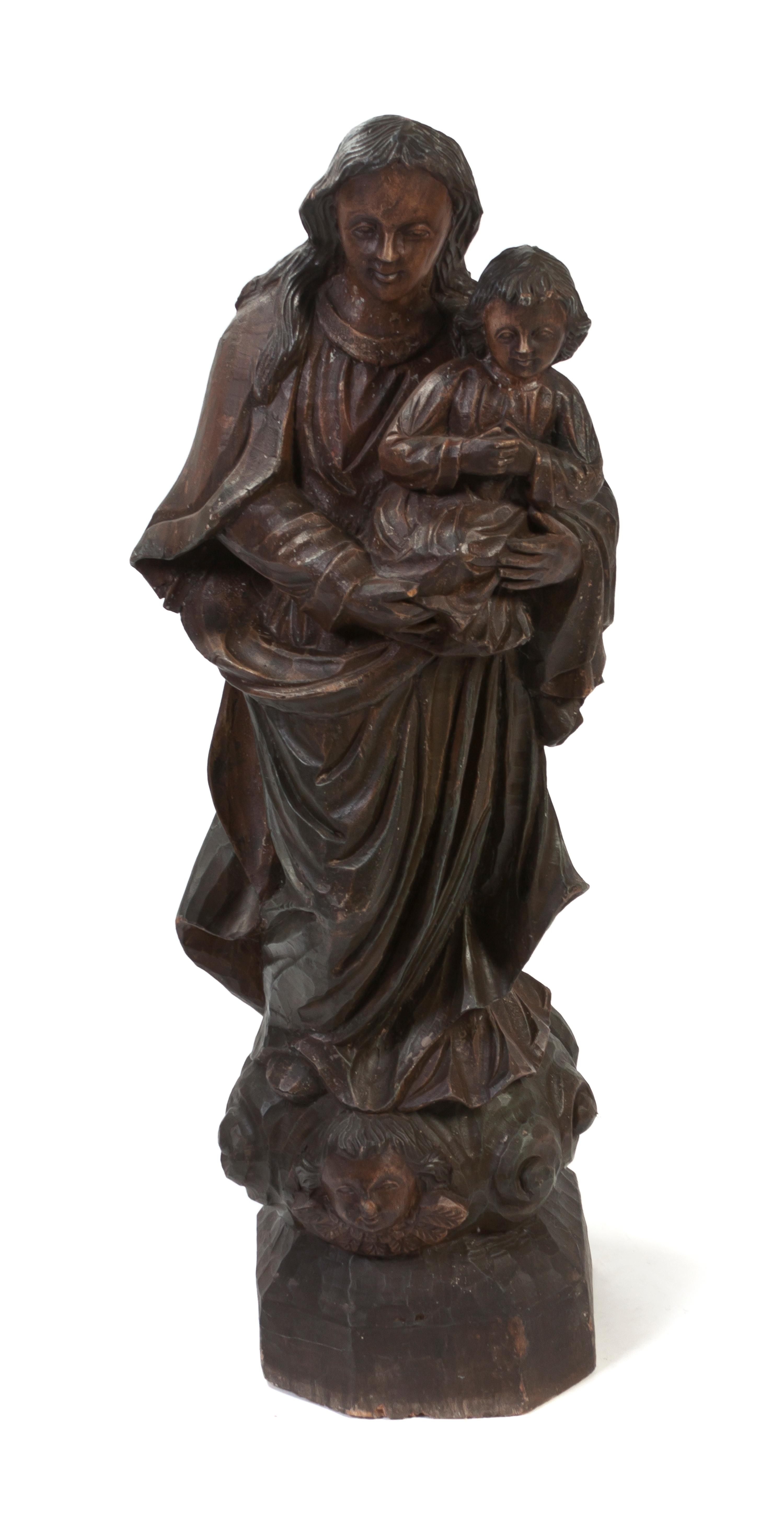 A Carved Wood Figural Group, Height 48 inches.
