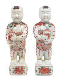A Pair of Chinese Export Porcelain Models of Standing Boys