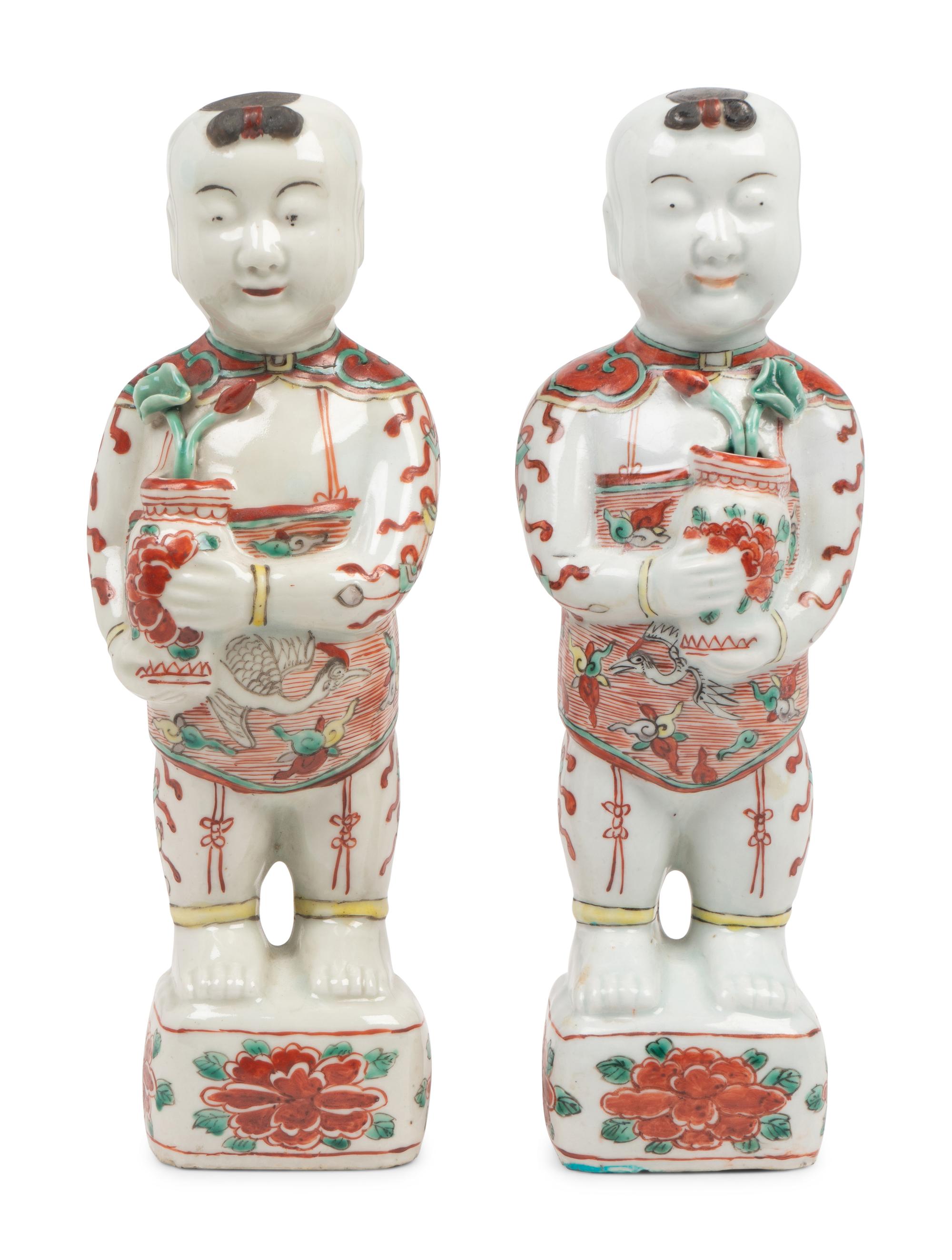 A Pair of Chinese Export Porcelain Models of Standing Boys