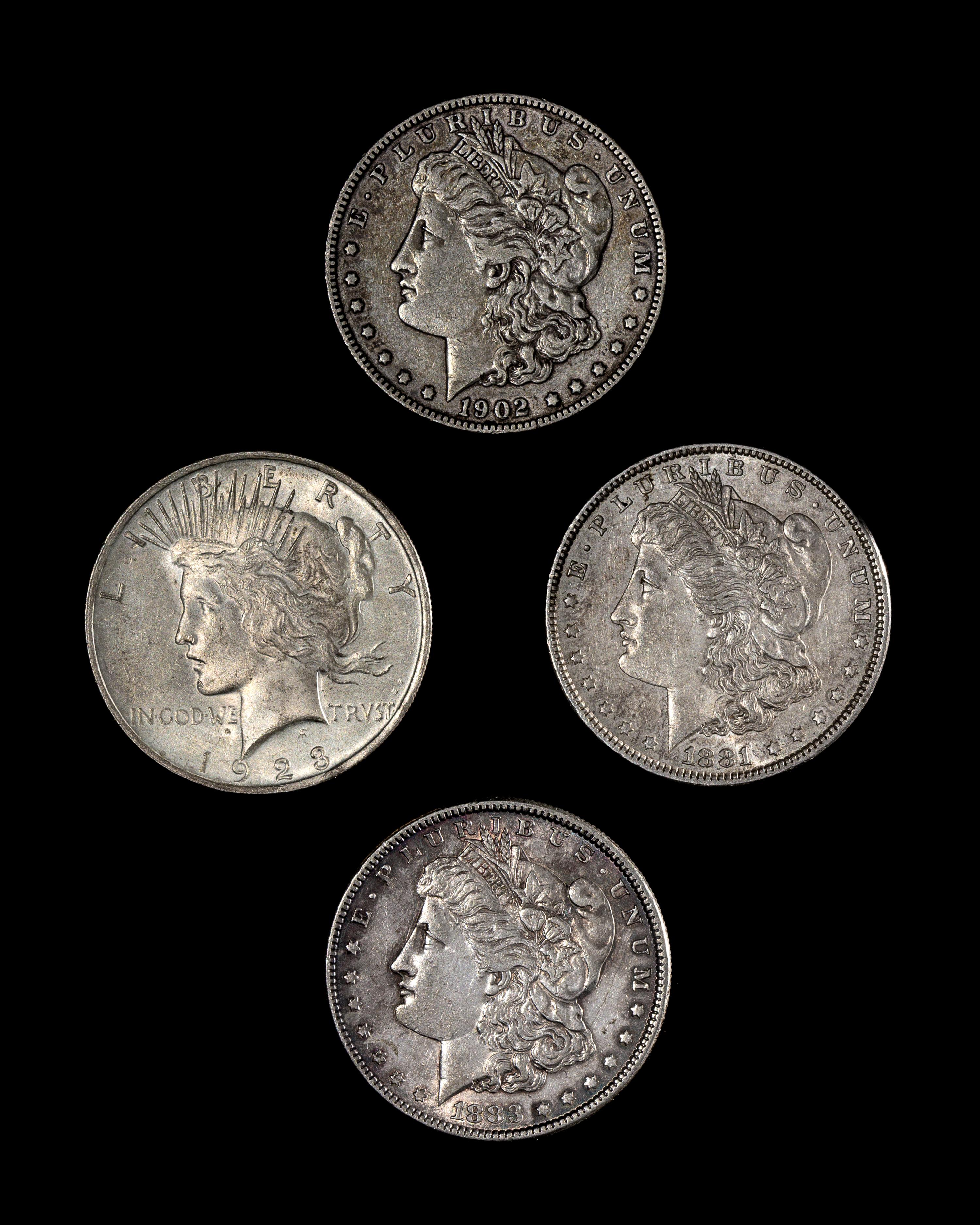 A Group of Three United States Morgan Silver $1 Coins