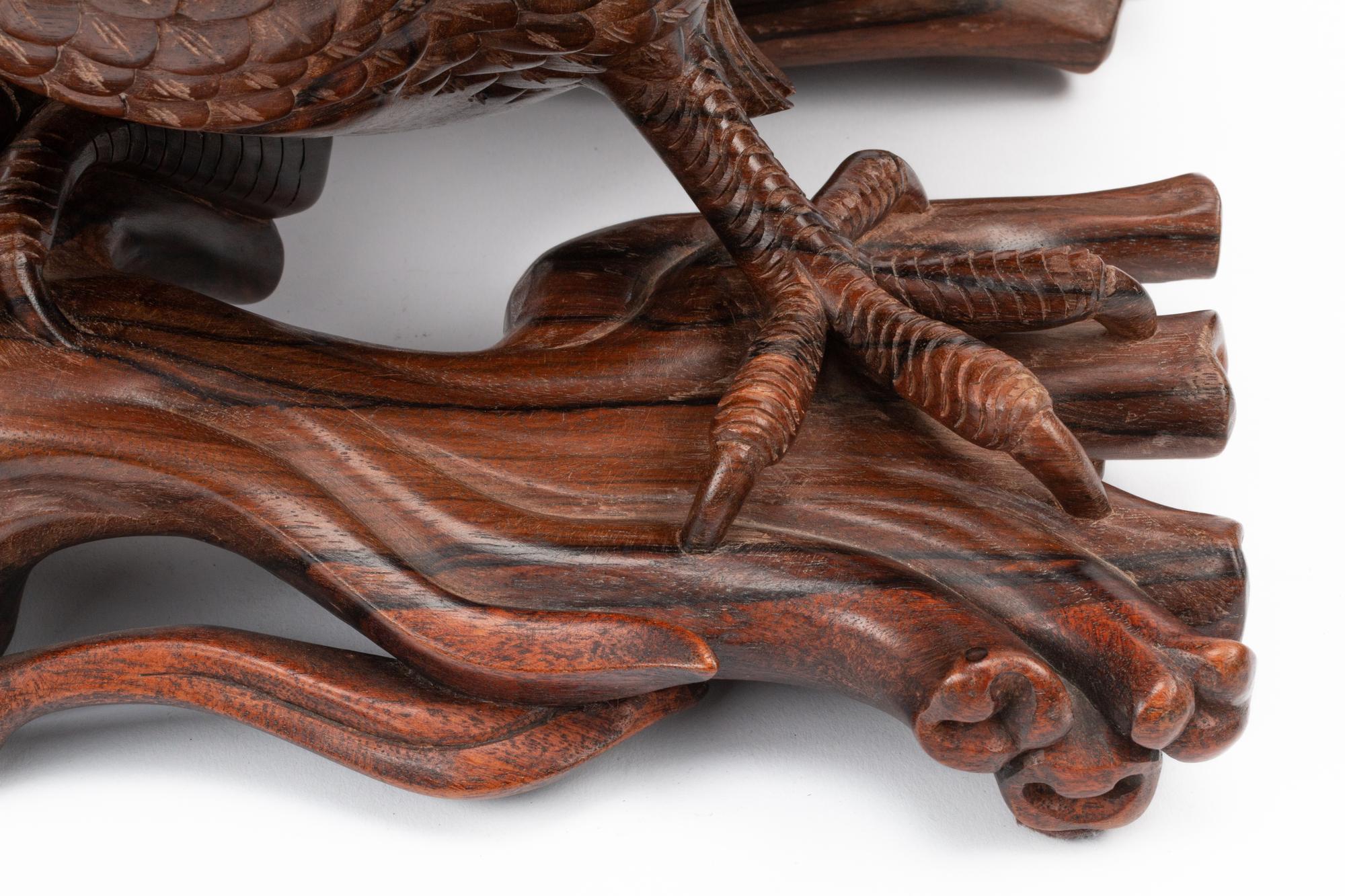 A Japanese Export Carved Rosewood Bird Group