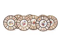 A Set of Eight English Porcelain Dinner Plates
