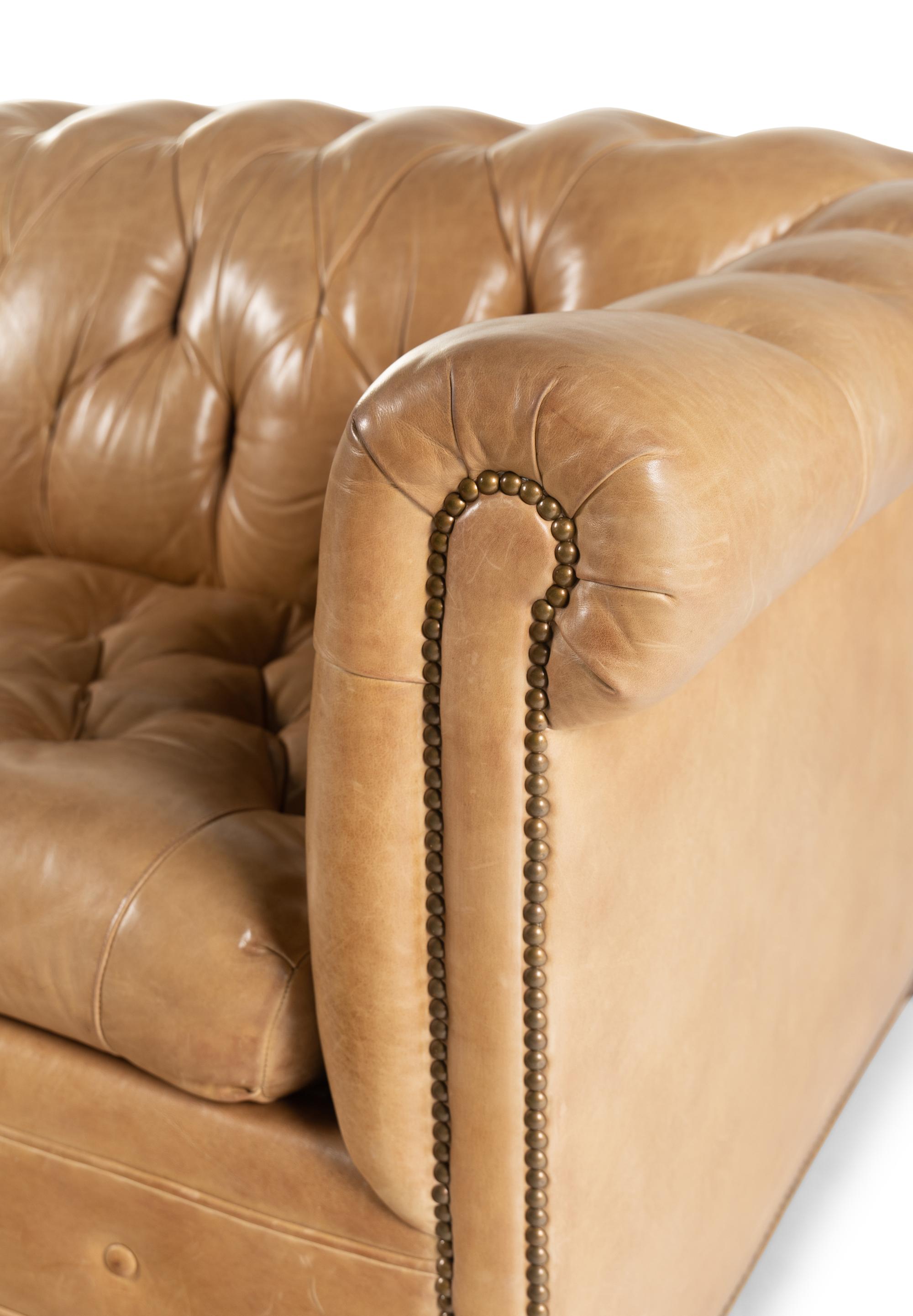 A Leather Upholstered Chesterfield Convertible Sofa