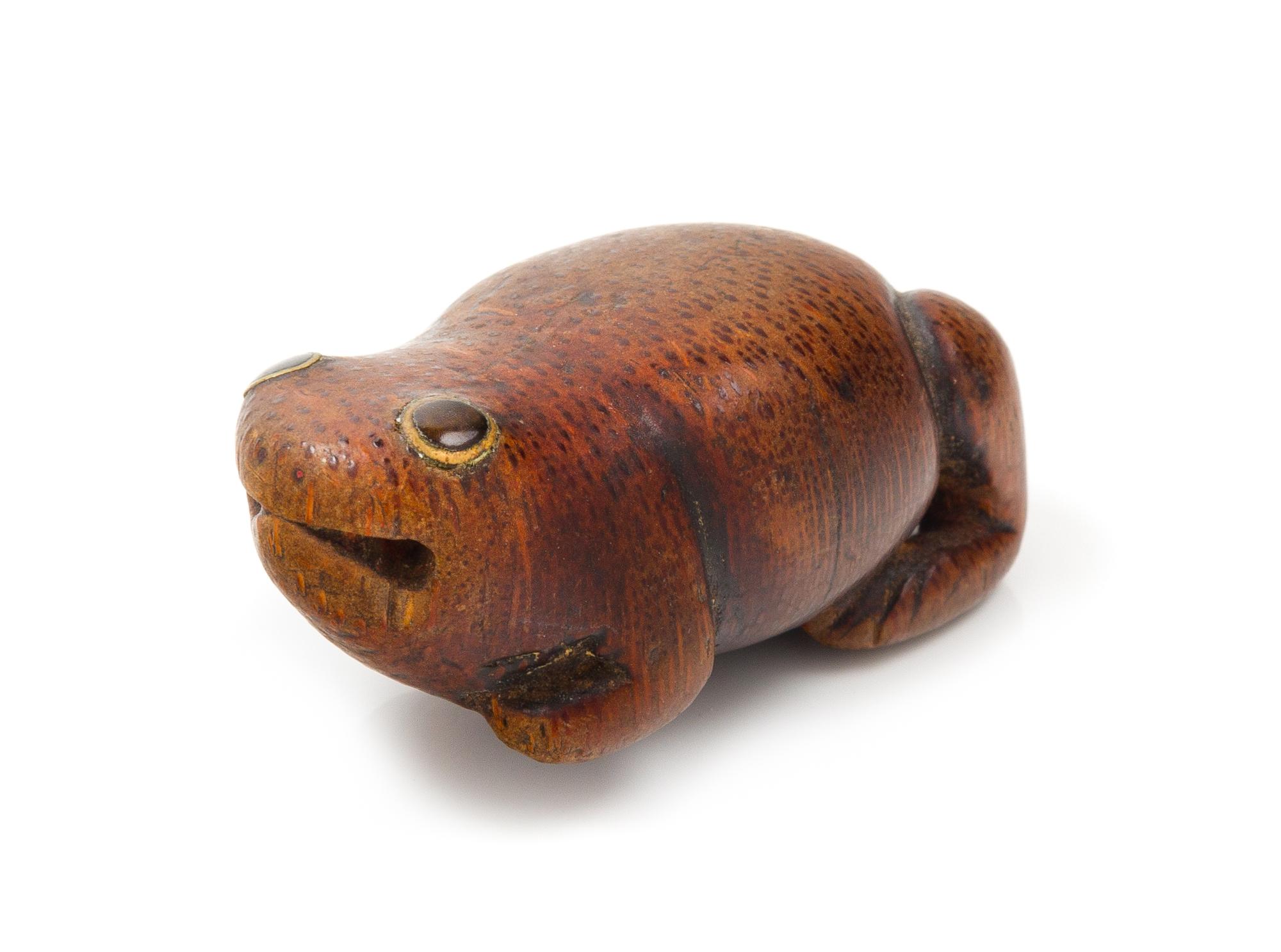 A Japanese Boxwood Netsuke Length 2 inches. — 19TH CENTURY