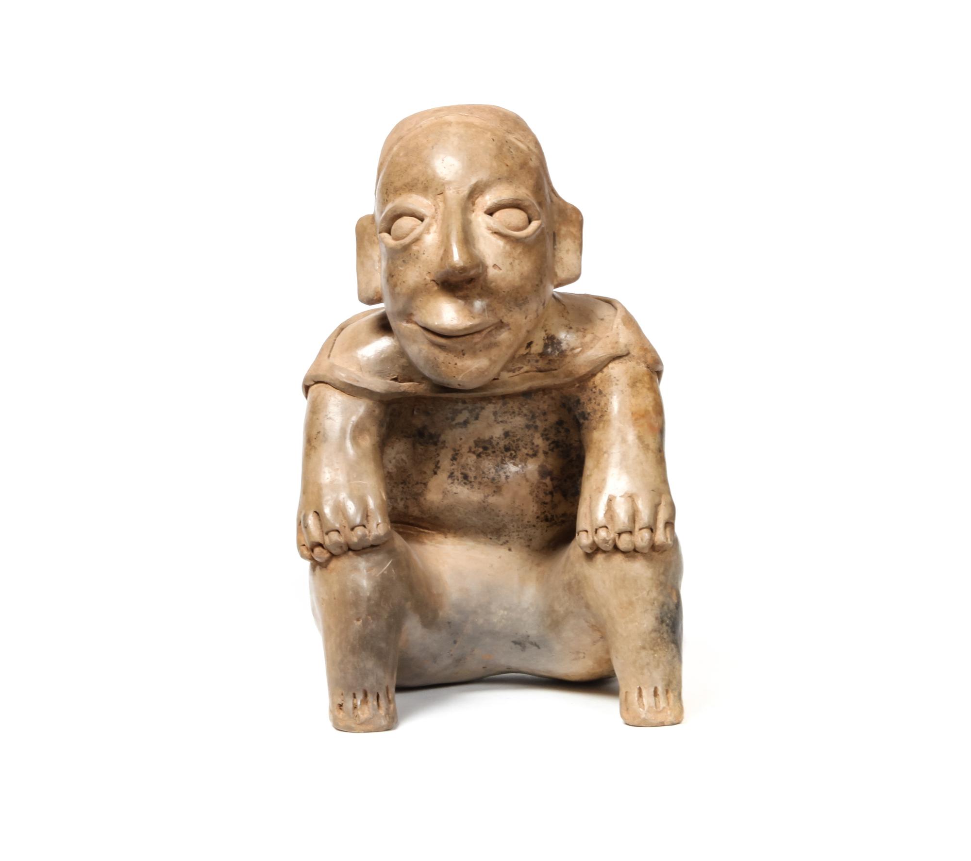Jalisco Seated Figure Height 10 1/2 x width 6 1/2 x depth 8 inches