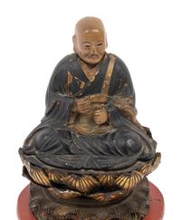 A Japanese Lacquered Wood Figure of a Seated Monk