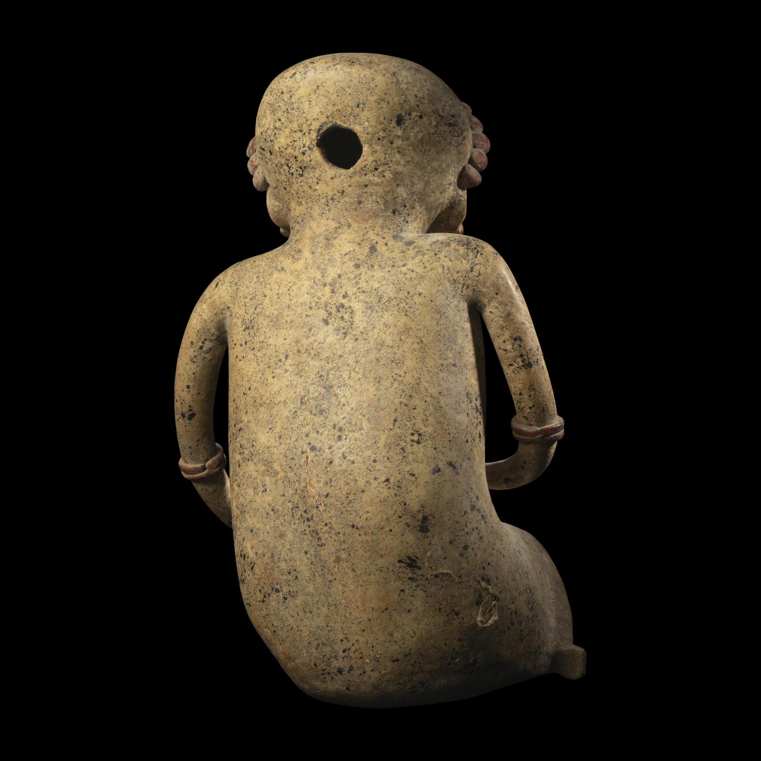A Nayarit Terracotta Seated Figure with Dog