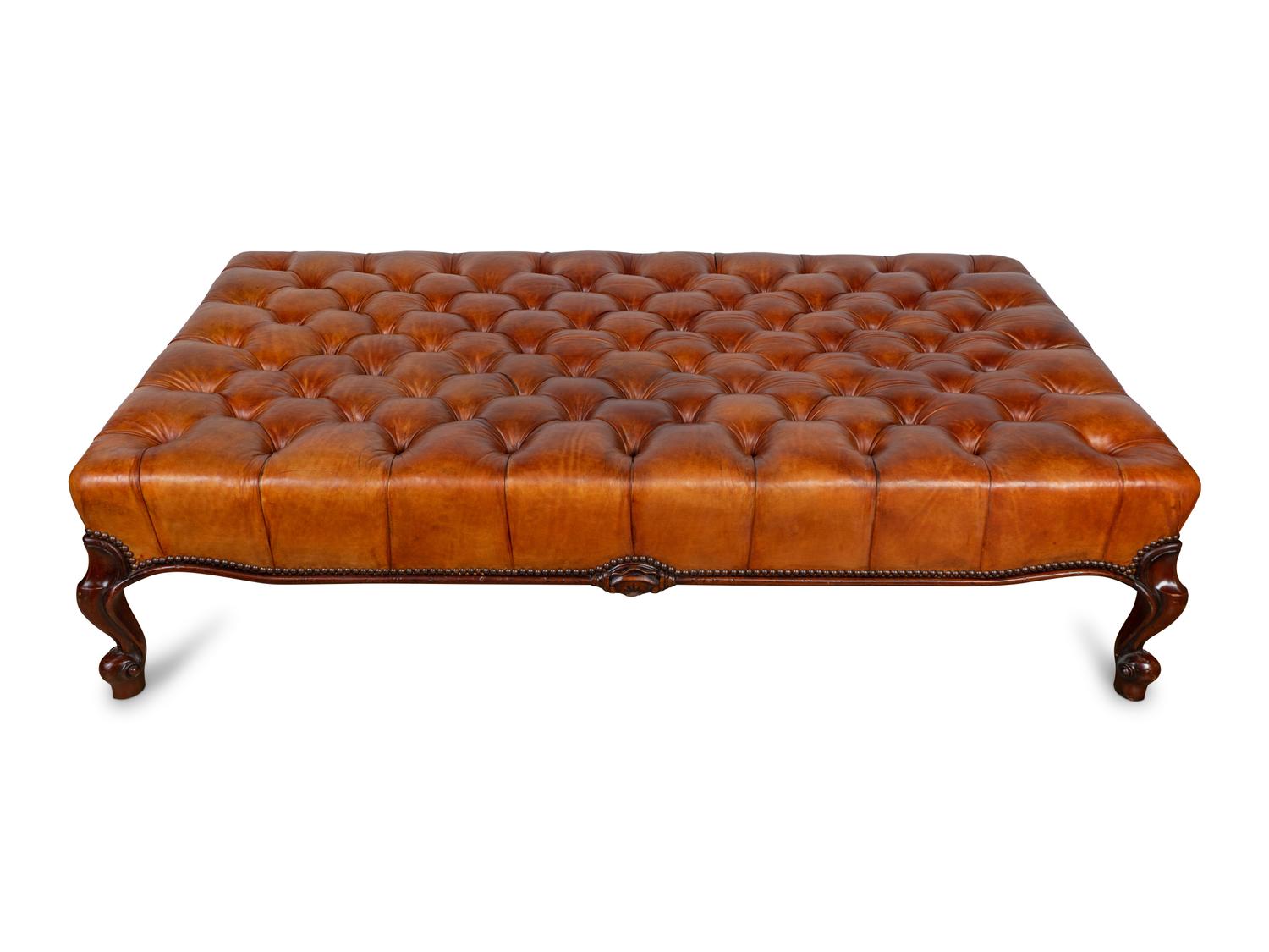 A Leather Tufted Ottoman — 20TH CENTURY