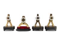 A Group of Four Brass Skeleton Clocks