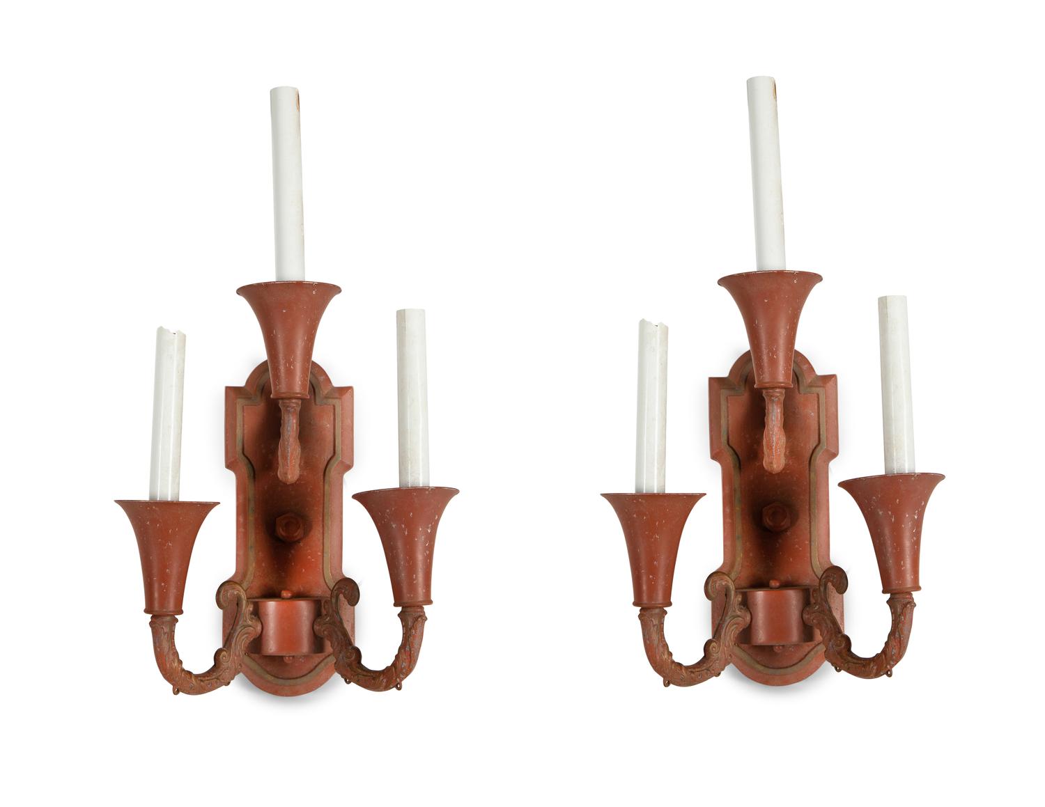 A Pair of Red and Gilt Decorated Tole Three-Light Wall Sconces