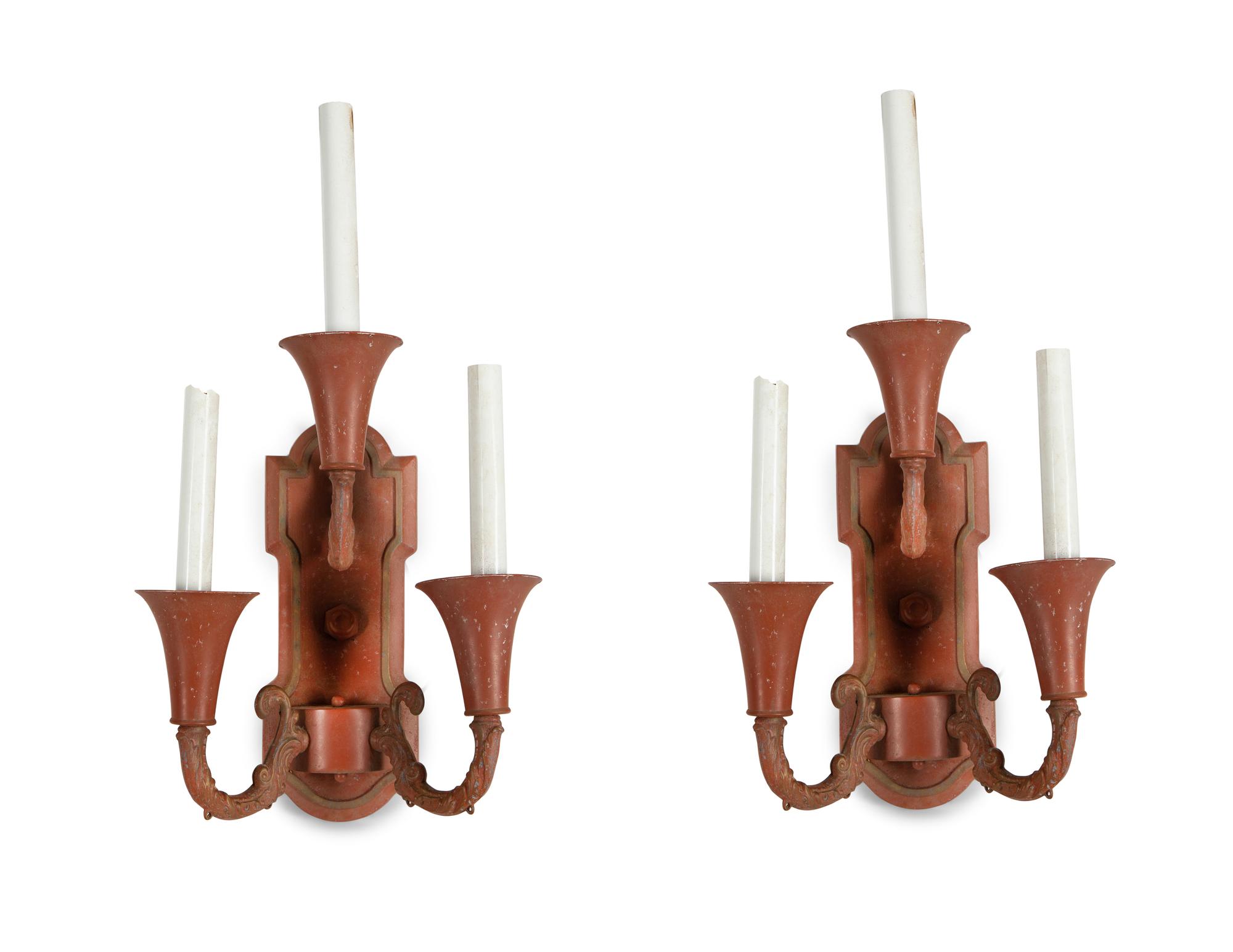A Pair of Red and Gilt Decorated Tole Three-Light Wall Sconces