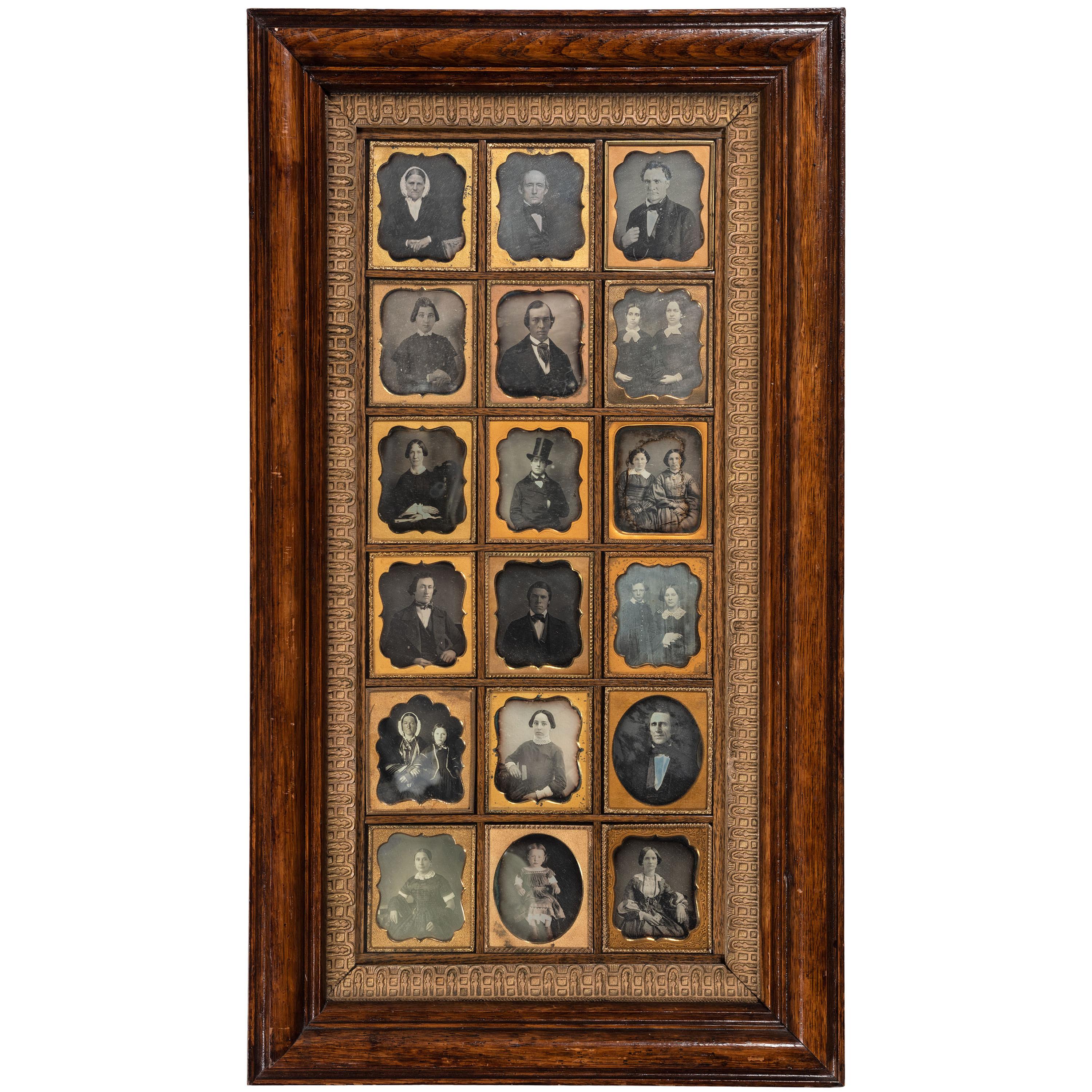 [EARLY PHOTOGRAPHY - PORTRAITURE]. A Daguerreian wall frame containing 18 uncredited sixth plate daguerreotype portraits of men, women, and children, including: